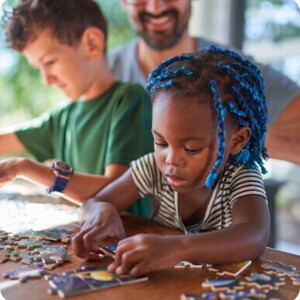 A girl puts together puzzles img